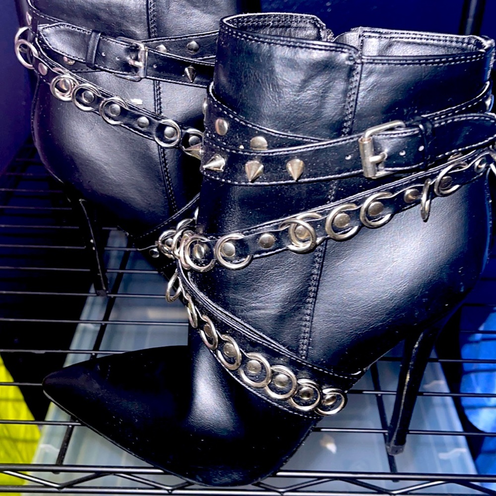 Never worn Black Ankle Boot with silver metal hardware.